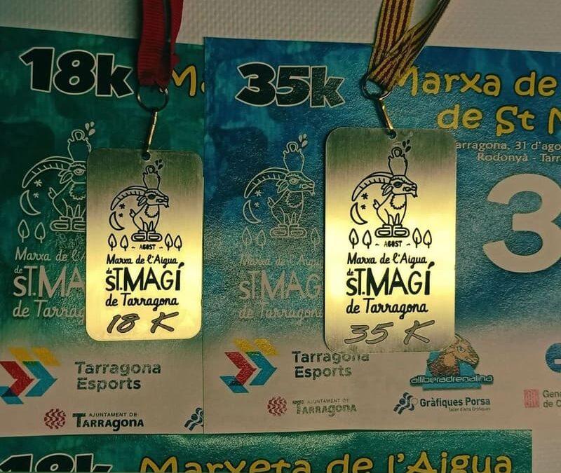 Aquí teniu els dorsals i la medalla que obtindreu en acabar!